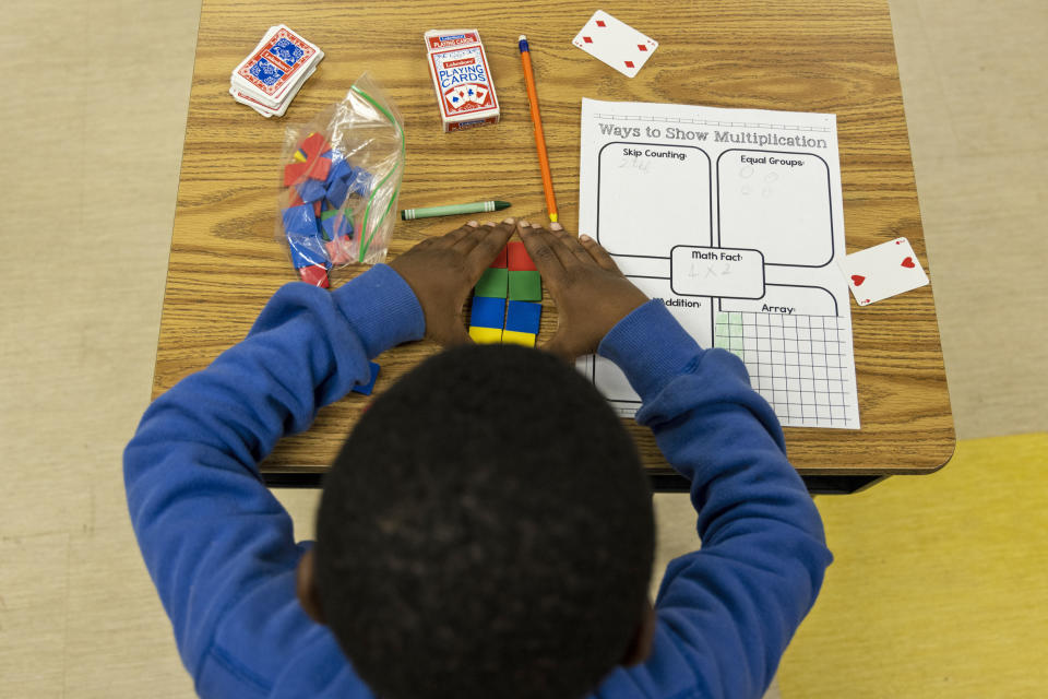 A student uses tiles while working on a multiplication problem at Ida Green Elementary. (Brad Vest / for NBC News)