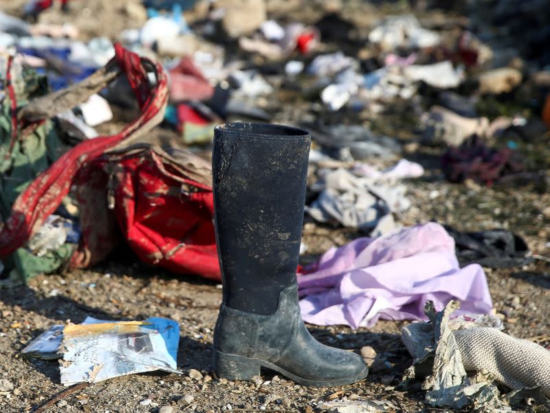 FILE PHOTO: Passengers' belongings are pictured at the site where the Ukraine International Airlines plane crashed after take-off from Iran's Imam Khomeini airport, on the outskirts of Tehran