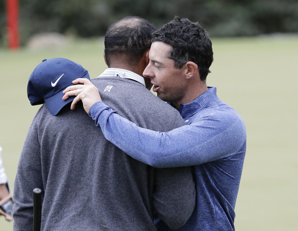 Tiger Woods, left, and Rory McIlroy, right, embrace after their match during fourth round play at the Dell Technologies Match Play Championship golf tournament, Saturday, March 30, 2019, in Austin, Texas. Woods won the match. (AP Photo/Eric Gay)