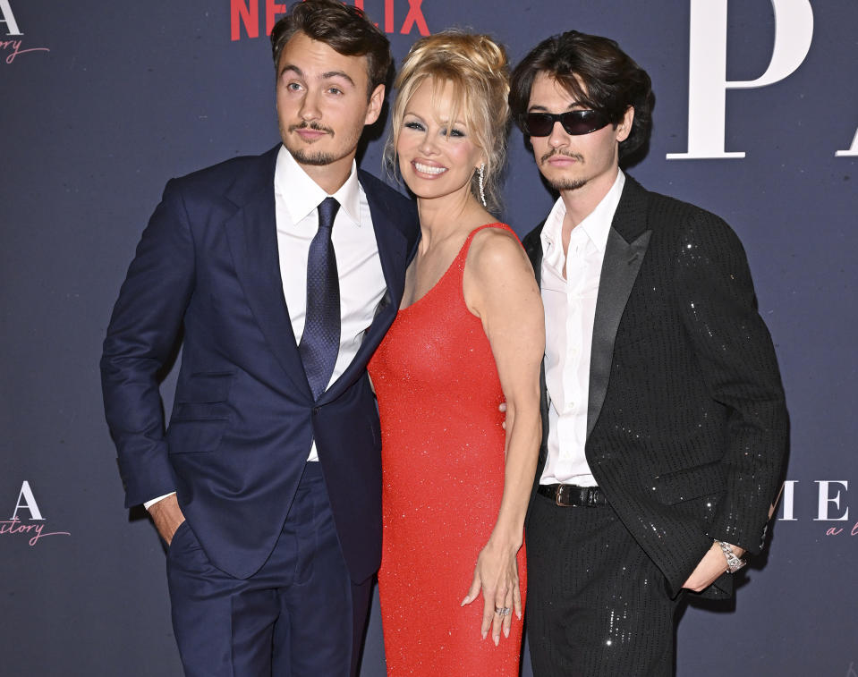 <p>Pamela Anderson <a href="https://people.com/parents/pamela-anderson-says-sons-miracle-perfect-gentleman/" rel="nofollow noopener" target="_blank" data-ylk="slk:poses with her two sons;elm:context_link;itc:0;sec:content-canvas" class="link ">poses with her two sons</a>, Brandon Thomas Lee and Dylan Jagger Lee, at the premiere of <a href="https://people.com/movies/pamela-anderson-says-its-emotional-to-watch-her-life-story-in-netflix-documentary-exclusive/" rel="nofollow noopener" target="_blank" data-ylk="slk:Pamela, A Love Story;elm:context_link;itc:0;sec:content-canvas" class="link "><i>Pamela, A Love Story</i></a> on Jan. 30 in Hollywood. </p>