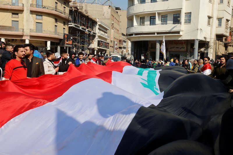 Protest against the dinar's slide in value against the U.S. dollar, near the central bank in Baghdad