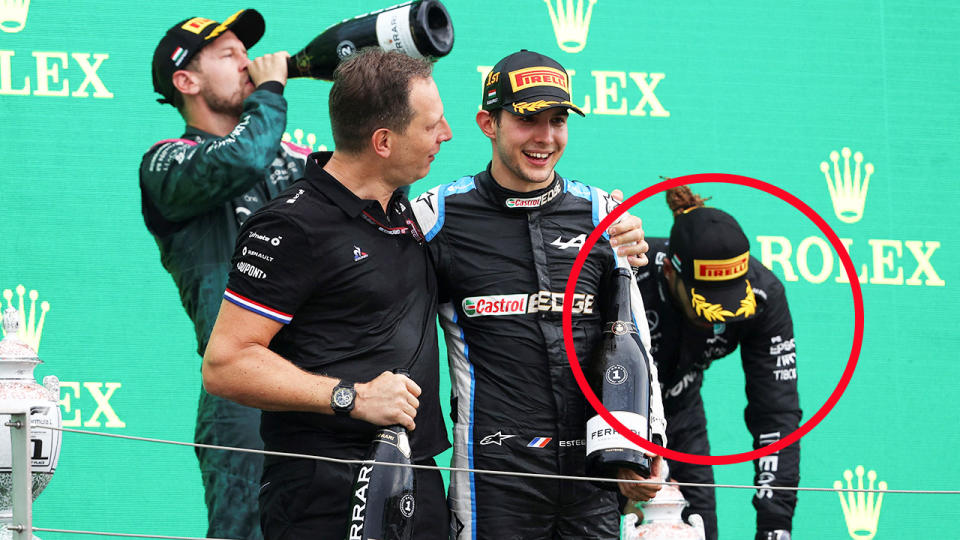 Lewis Hamilton, pictured here struggling on the podium after the Hungarian Grand Prix.