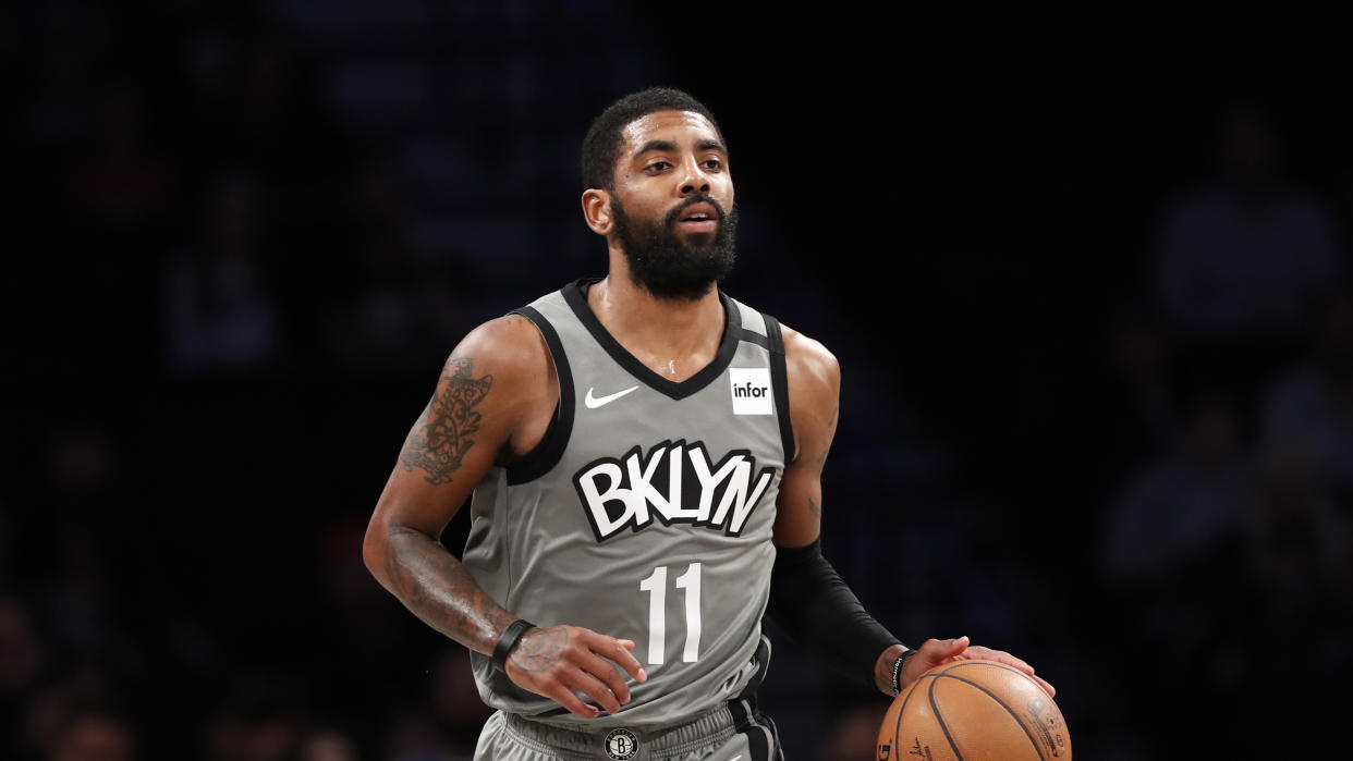 Brooklyn Nets guard Kyrie Irving (11) takes the ball down court during the first quarter of an NBA basketball game against the Utah Jazz, Tuesday, Jan. 14, 2020, in New York. (AP Photo/Kathy Willens)