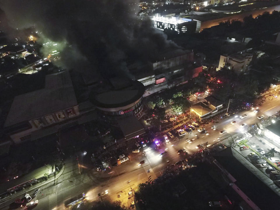 Smoke billows from a mall as it catches fire shortly after a strong earthquake struck General Santos city, South Cotabato province, southern Philippines on Wednesday Oct. 16, 2019. A powerful and shallow earthquake hit several southern Philippine provinces Wednesday night injuring some people in collapsed houses and prompting thousands to scramble out of homes, shopping malls and a hospital in panic, officials and news reports said. Officials also added that it was still unclear if the fire was sparked by the temblor. (AP Photo/Allan Jay Resane)