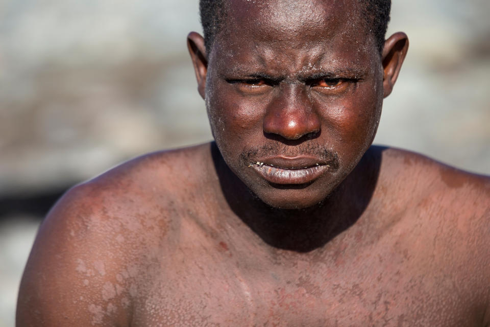 A man looks on after arriving at the Aguila beach on the island of Gran Canaria.