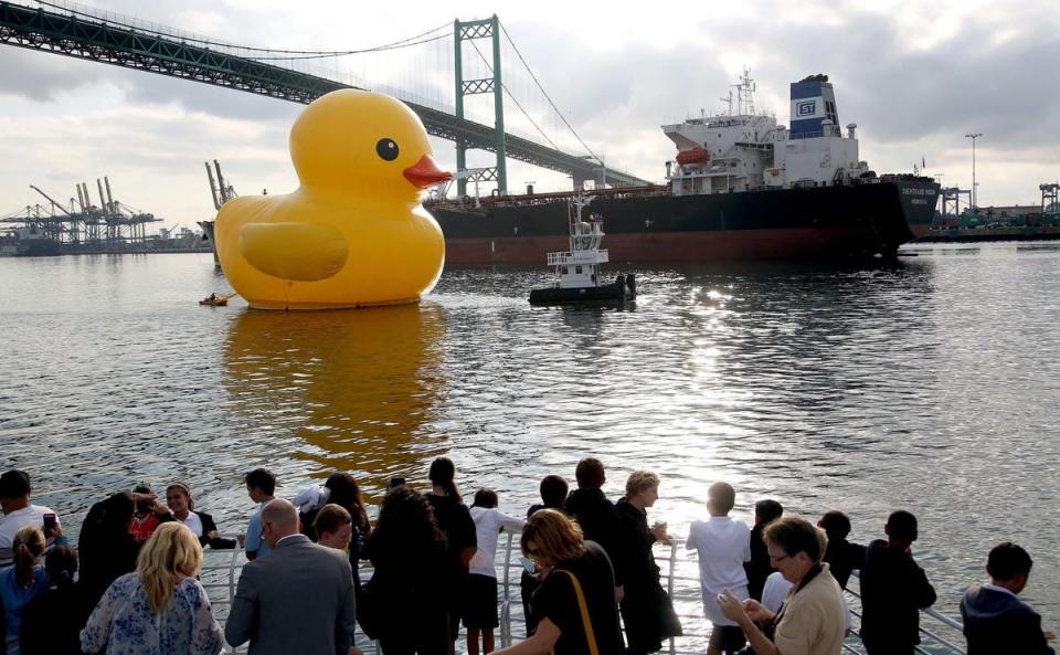 A giant inflatable rubber duck is towed into the Port of Los Angeles on Aug. 20, 2014, to kick off the Tall Ships Festival LA. The duck, billed as "The World's Largest Rubber Duck," is scheduled to be part of the Tall Ships Erie festival in September. FILE PHOTO/Associated Press