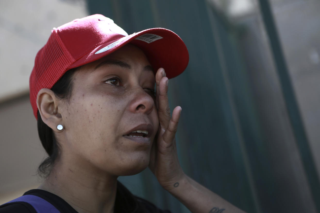 Venezuelan migrant Viangly Infante Padrón stands outside a general hospital waiting to hear news about her husband who is being treated for smoke inhalation, in Ciudad Juarez, Mexico, Thursday, March 30, 2023. Infante Padrón says she was waiting outside the immigration detention center Monday evening for the release of her husband, when a fire broke out in a dormitory leaving more than three dozen migrants dead. (AP Photo/Christian Chavez)