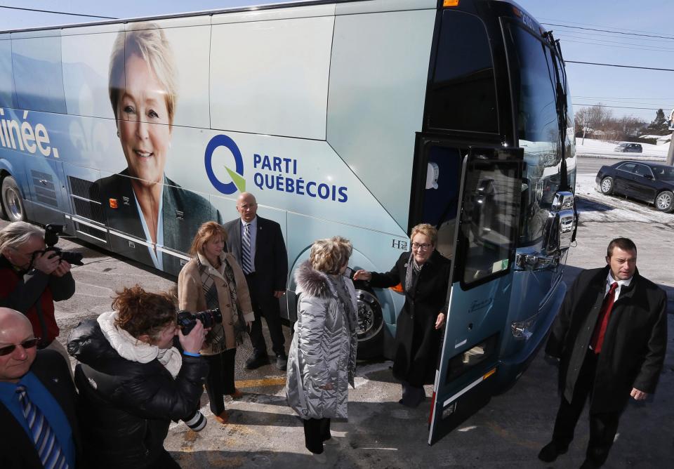 Parti Quebecois leader Pauline Marois greets candidate Gyslaine Desrosiers during a campaign stop in Blainville