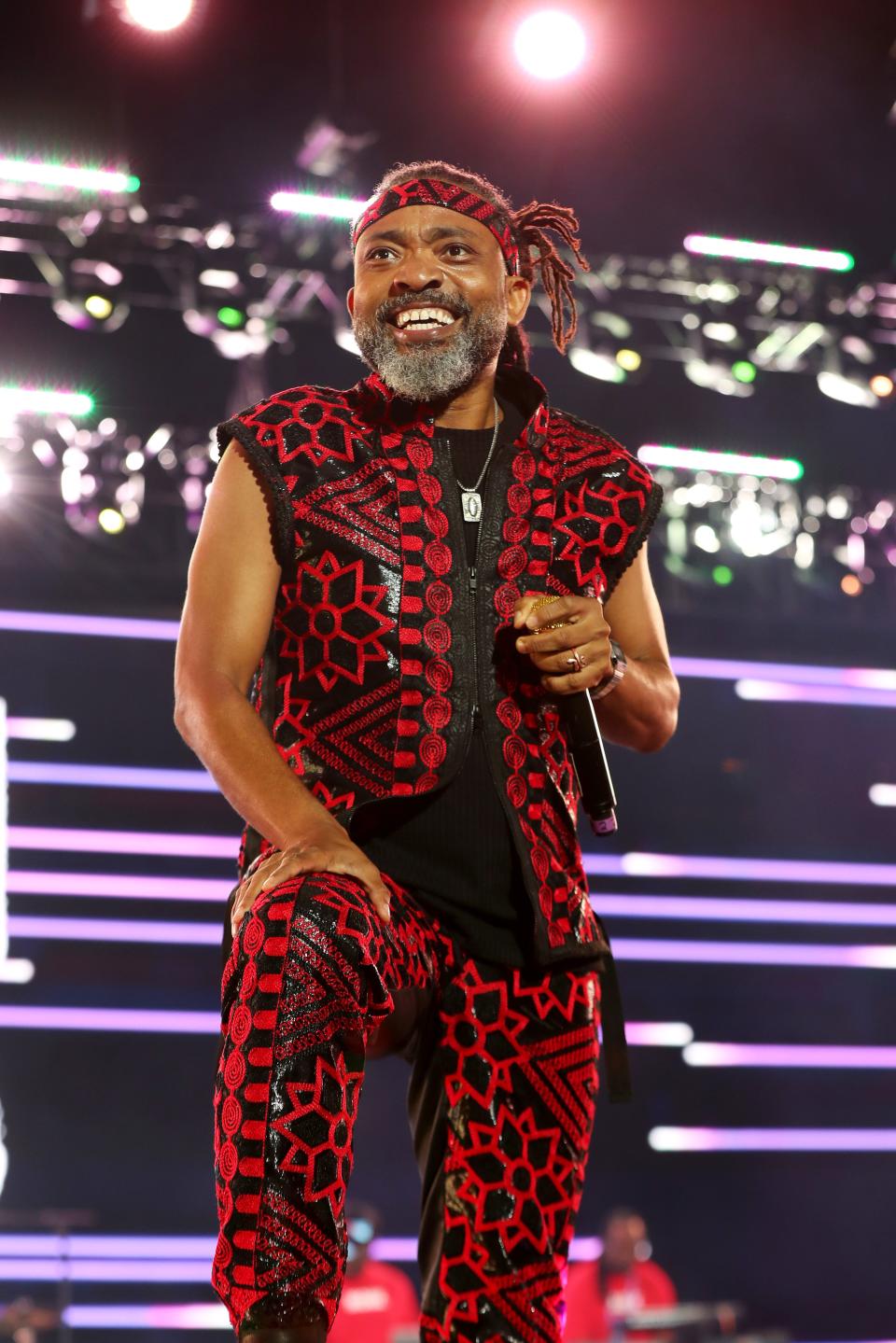 Machel Montano in a red and black floral set