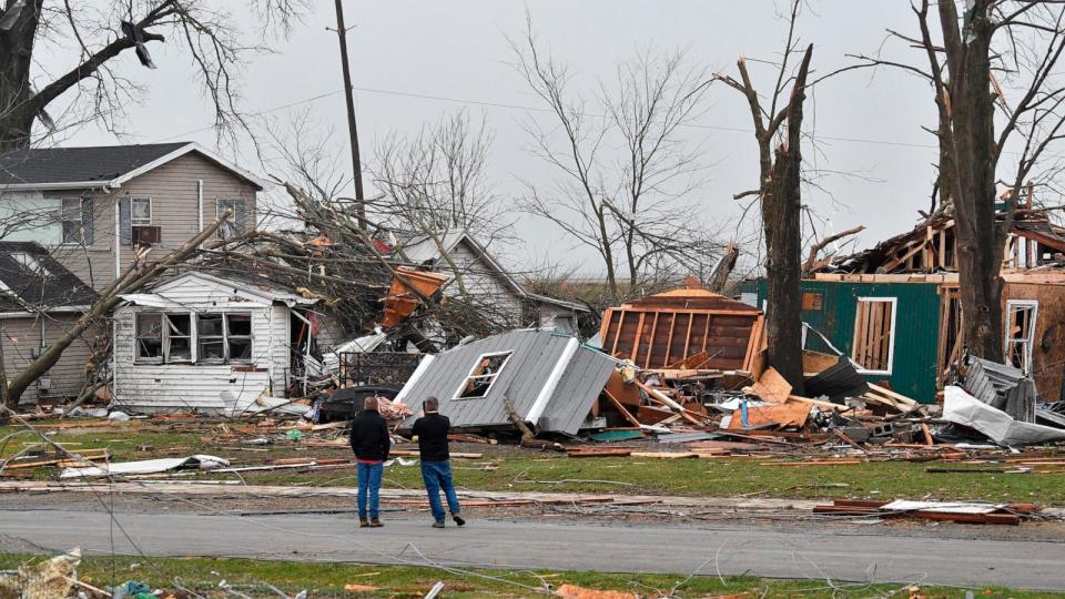 PHOTO: Residents of Lakeview, Ohio survey the damage following a severe storm, March 15, 2024.  (Timothy D. Easley/AP)