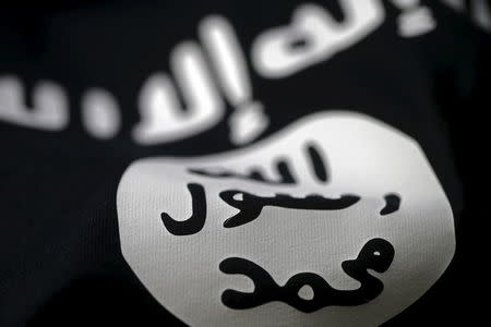 An Islamic State flag is seen in this picture illustration taken February 18, 2016. Picture taken February 18, 2016. REUTERS/Dado Ruvic/Illustration