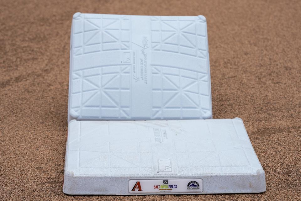 FILE - The new, larger base is seen with the older, smaller base at Salt River Field Tuesday, Feb. 14, 2023, in Scottsdale, Ariz. Major League Baseball's bases were increased from 15-inch squares to 18, which will lead to increased stolen bases. (AP Photo/Morry Gash, FIle)