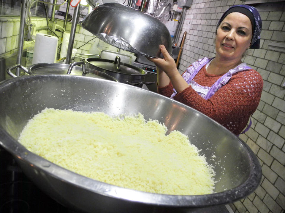 Habiba Hachemi from Algeria seen in one of two kitchens of 'Enoteca Maria', a restaurant where grandmothers (Nonnas) make food, on Staten Island, New York. (ohannes Schmitt-Tegge / picture alliance via Getty Images)