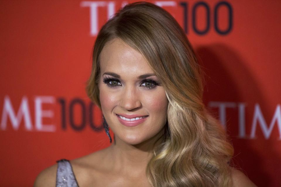 Honoree and singer Carrie Underwood arrives at the Time 100 gala celebrating the magazine's naming of the 100 most influential people in the world for the past year, in New York April 29, 2014. REUTERS/Lucas Jackson (UNITED STATES - Tags: ENTERTAINMENT)