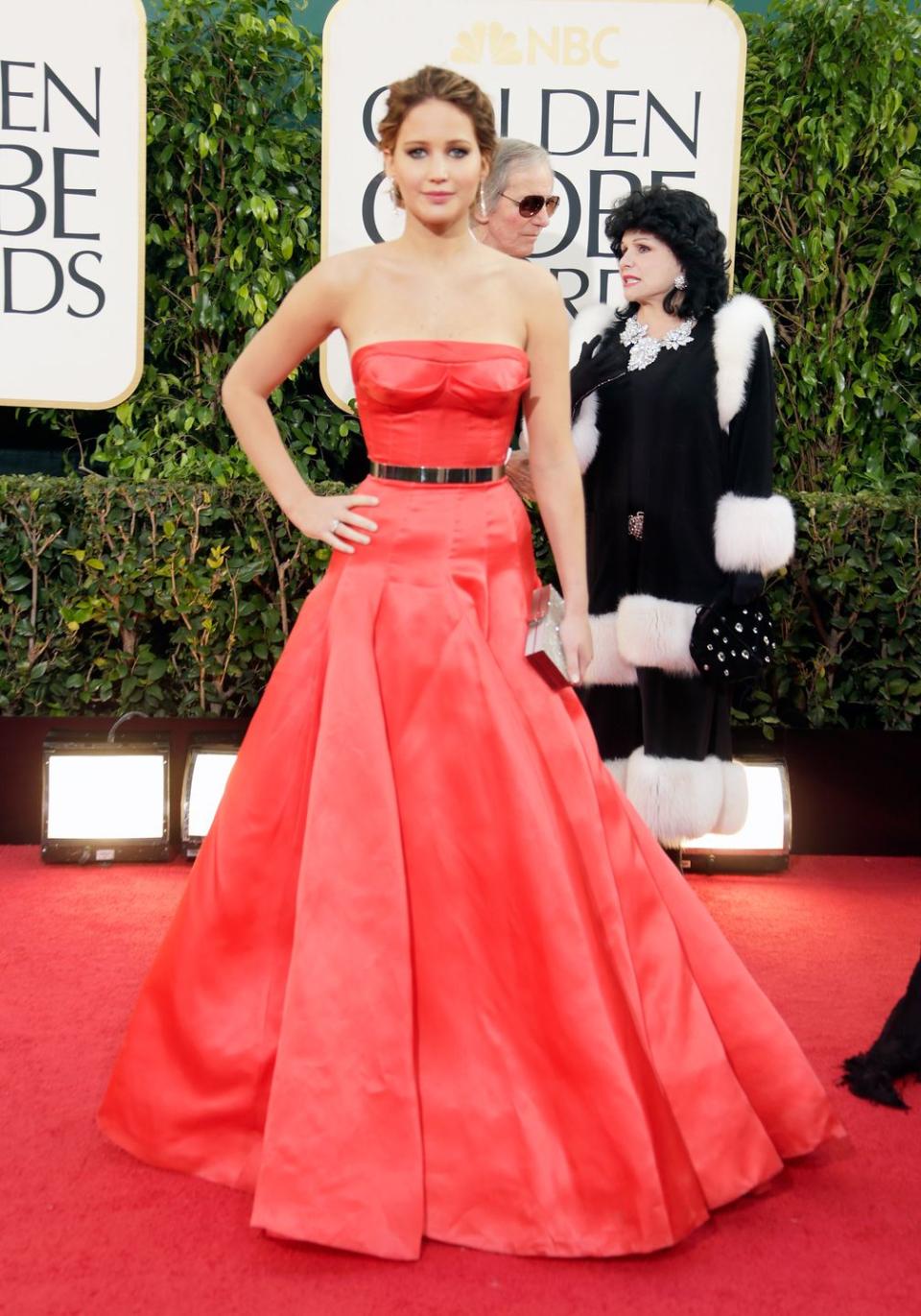<p>Jennifer Lawrence in a fiery belted Dior. </p>