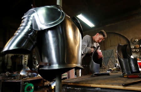 Blacksmith Johann Schmidberger works on a suit of armour for the Vatican's Swiss Guards at his workshop in Molln, Austria, March 29, 2017. Picture taken March 29, 2017. REUTERS/Leonhard Foeger