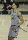 Baylor guard MaCio Teague (31) celebrates after shooting a 3-point shot in the second half of an NCAA college basketball game against Texas Tech Sunday, March 7, 2021, in Waco, Texas. (AP Photo/Jerry Larson)