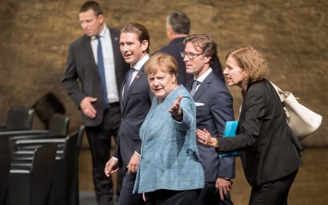 German Chancellor Angela Merkel and Austrian Chancellor Sebastian Kurz attend the dinner  - Credit: GEORG HOCHMUTH/AFP