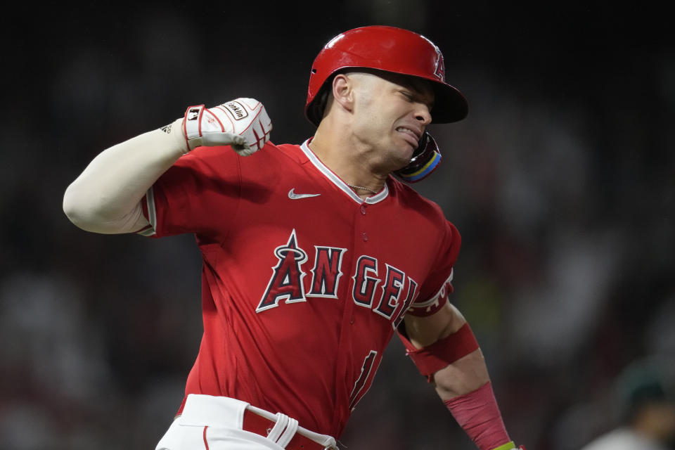 Los Angeles Angels' Logan O'Hoppe (14) reacts after hitting a home run during the seventh inning of a baseball game against the Oakland Athletics in Anaheim, Calif., Saturday, Sept. 30, 2023. Brandon Drury also scored. (AP Photo/Ashley Landis)