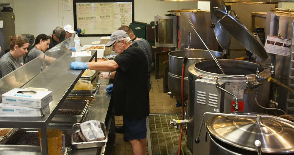 Chef John Pollei, foreground, is pictured in the Community Kitchen on Rosa L. Jones Boulevard in Cocoa, where food for Meals on Wheels and Seniors at Lunch sites gets prepared. An 80-gallon kettle used in food prep is broken, and the Space Coast community stepped up to help buy a new one.