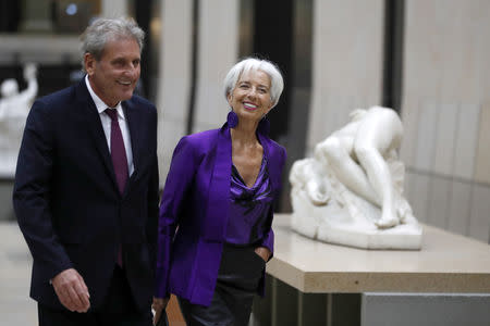 International Monetary Fund (IMF) Managing Director Christine Lagarde and her partner Xavier Giocanti arrive at the official dinner at the Orsay Museum, as part of the commemoration ceremony for Armistice Day, 100 years after the end of the First World War, in Paris, France, November 10, 2018. Ian Langsdon/Pool via REUTERS