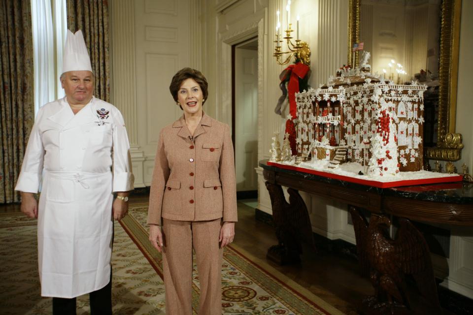 Laura Bush shows the gingerbread White House in 2006.