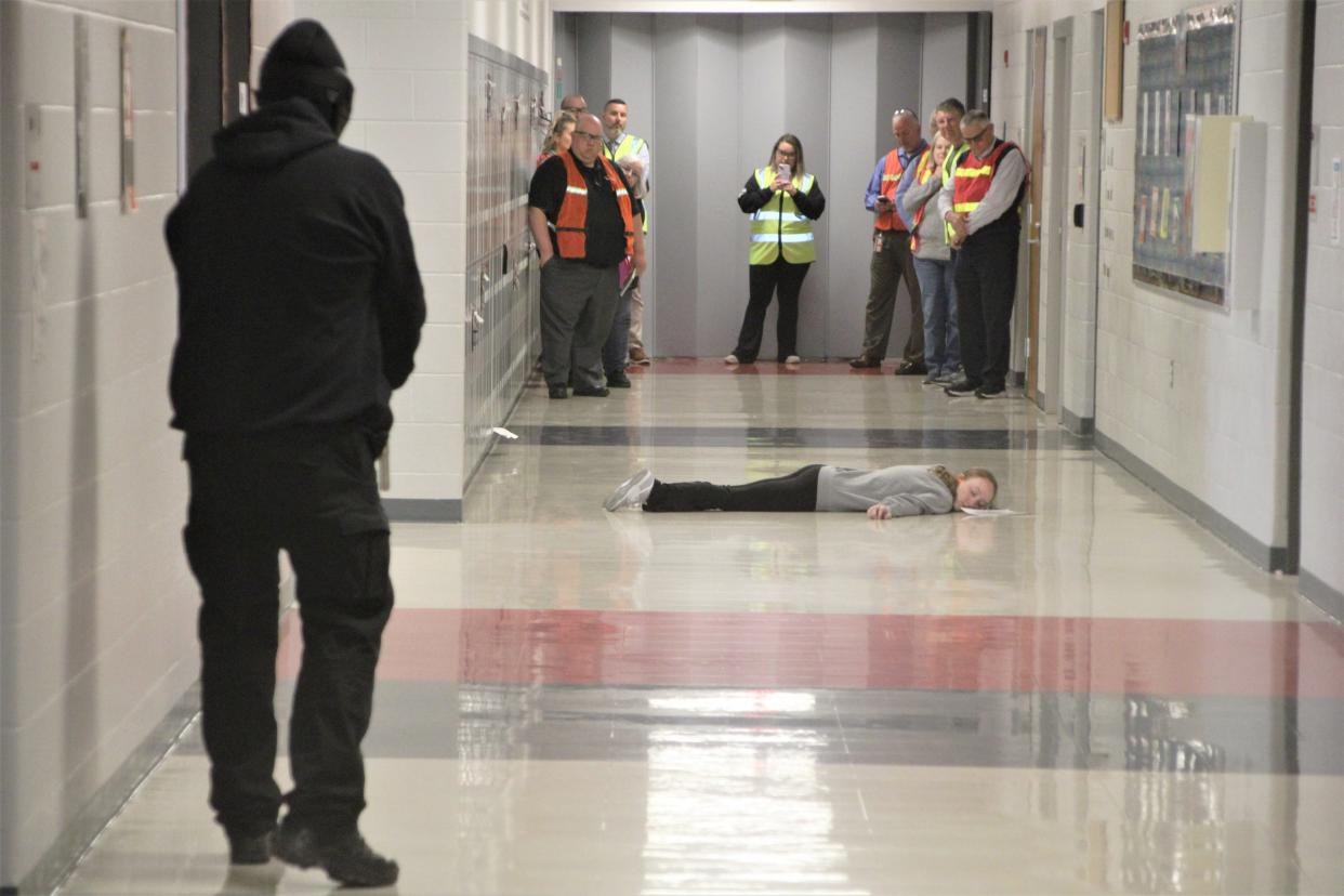 Marion County school and local government officials watch as the active shooter incident scenario plays out on Wednesday, May 17, 2023, at Elgin Local Schools. Local law enforcement agencies and fire departments as well as students and staff members from Elgin Local Schools participated in the exercise. Capt. Ryan Zempter from the Marion County Sheriff's Office said law enforcement officials hope to conduct active shooter incident scenarios at all school districts in the county.