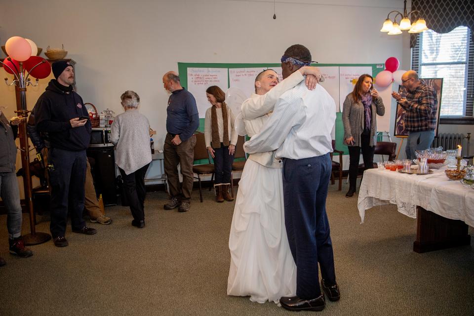 Christie and Jeffery Glenn have their first dance as husband and wife while surrounded by area shelter volunteers and members of Buncombe County’s Community Paramedicine program, January 21, 2024.