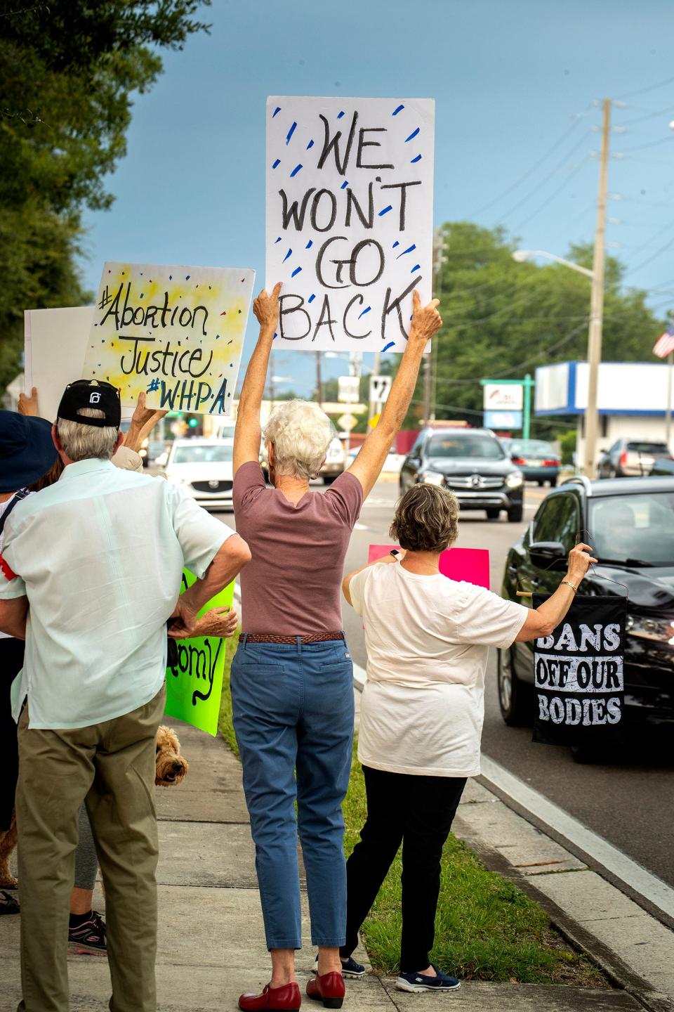 Protesters demonstrate against a Supreme Court decision overturning Roe v. Wade on South Florida Avenue in Lakeland on Friday.