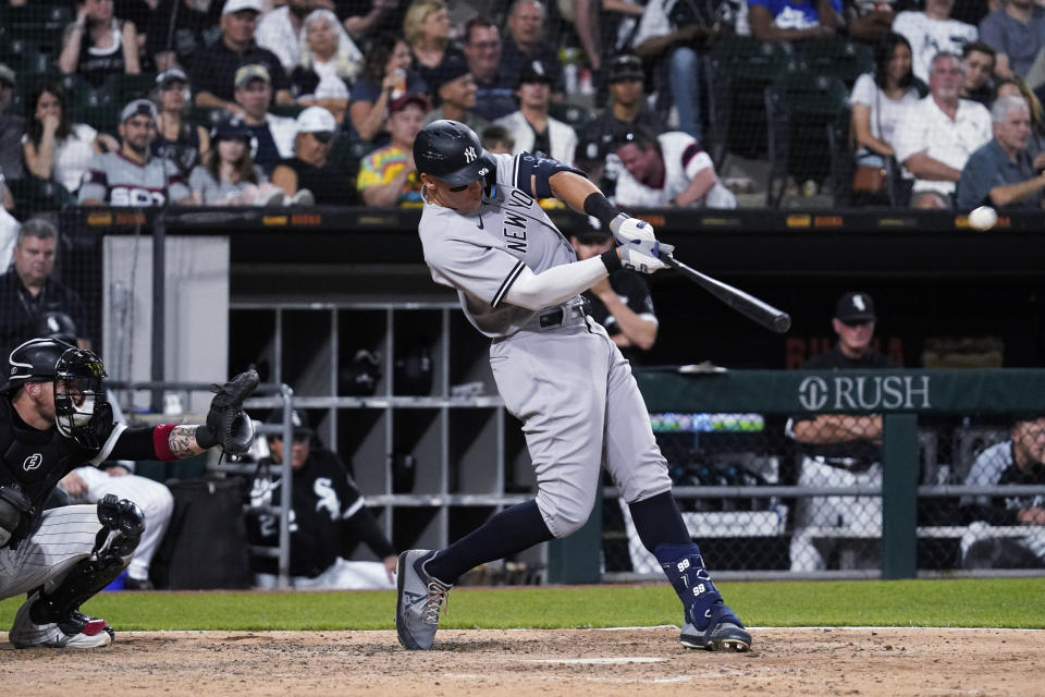 New York Yankees' Aaron Judge hits a solo home run against the Chicago White Sox during the seventh inning of a baseball game in Chicago, Thursday, May 12, 2022. (AP Photo/Nam Y. Huh)