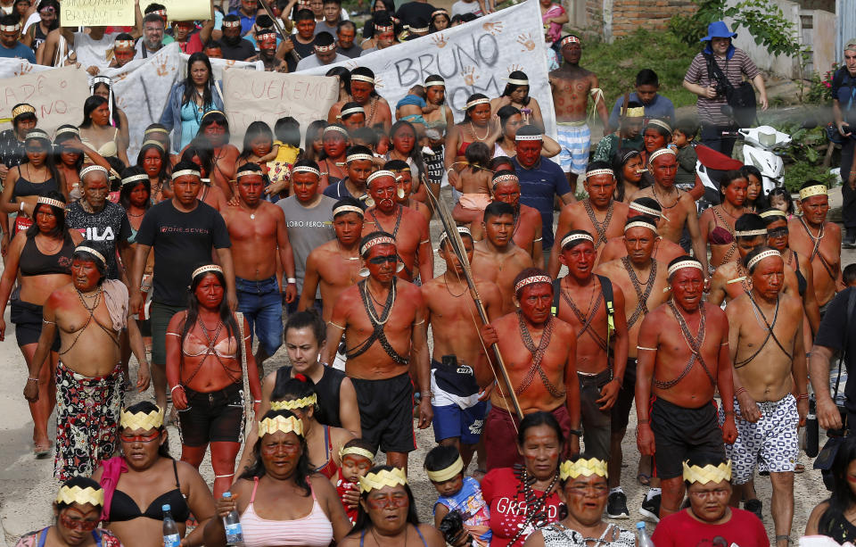Indigenous people march to protest against the disappearance of Indigenous expert Bruno Pereira and freelance British journalist Dom Phillips, in Atalaia do Norte, Vale do Javari, Amazonas state, Brazil, Monday, June 13, 2022. Brazilian police are still searching for Pereira and Phillips, who went missing in a remote area of Brazil's Amazon a week ago. (AP Photo/Edmar Barros)