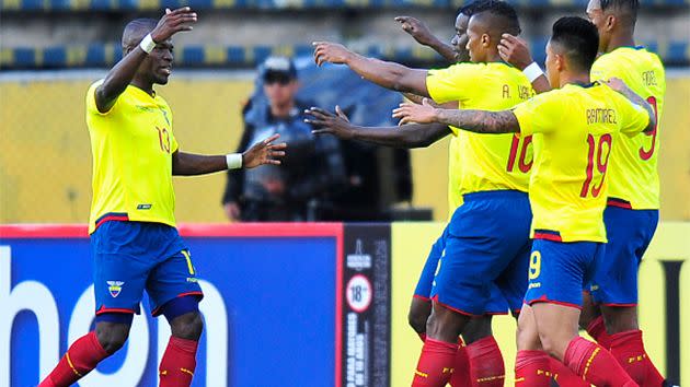 Valencia (L) celebrates a goal with teammates. Image: AFP