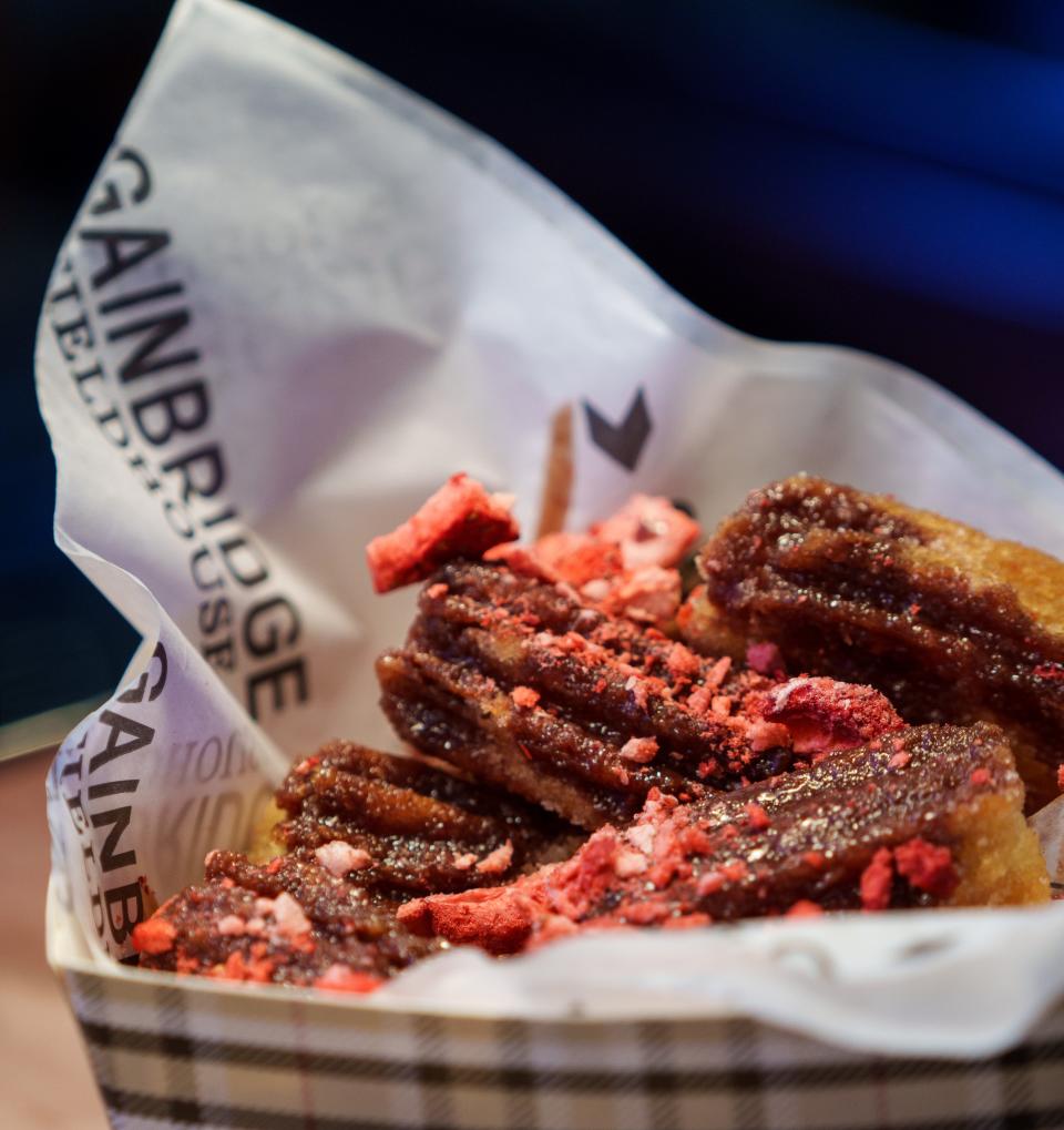 Cinnamon sugar churro bites, which features a Nutella glaze with freeze-dried strawberries for added crunch, sit on display Monday, Oct. 16, 2023, at a press conference announcing food options for the 2023-24 event season inside Gainbridge Fieldhouse.