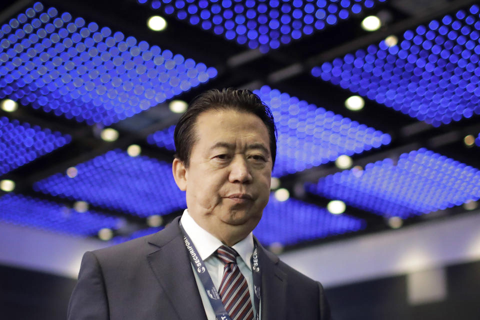FILE - Interpol President, Meng Hongwei, walks toward the stage to deliver his opening address at the Interpol World Congress in Singapore, July 4, 2017. (AP Photo/Wong Maye-E, File)