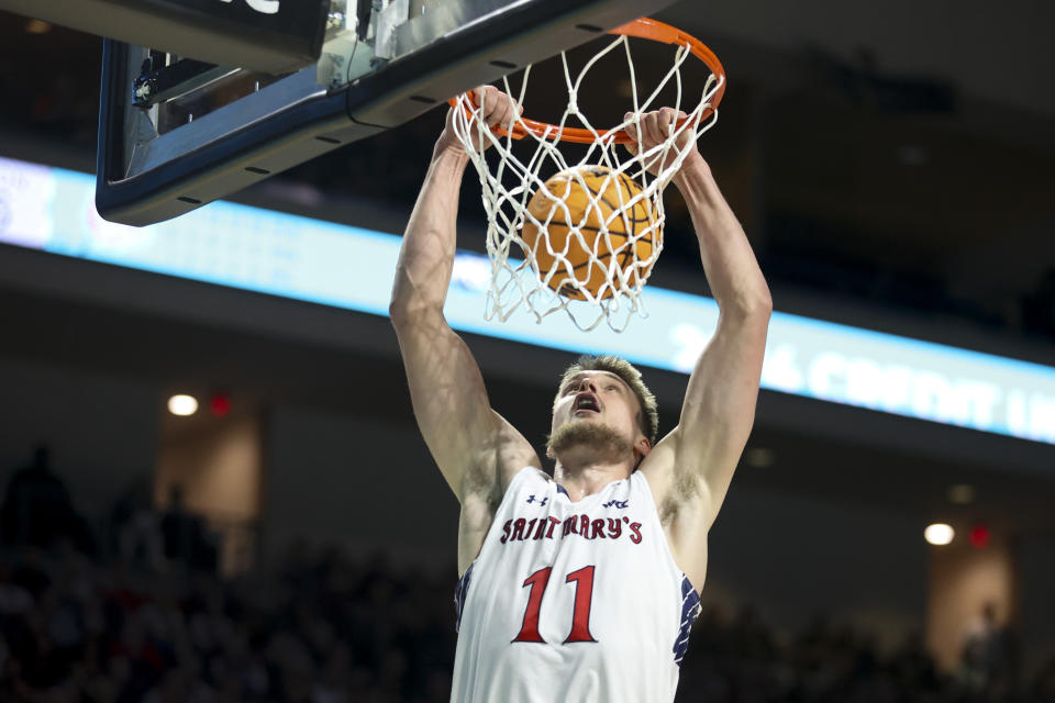 Saint Mary's center Mitchell Saxen (11) dunks the ball against Gonzaga during the first half of an NCAA college basketball game in the championship of the West Coast Conference tournament Tuesday, March 12, 2024, in Las Vegas. (AP Photo/Ian Maule)