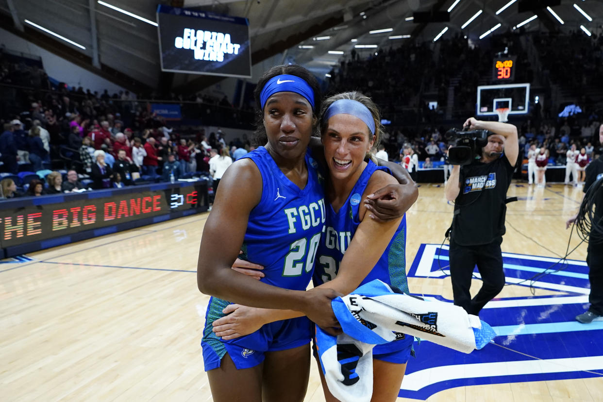 Florida Gulf Coast's Sha Carter, left, embraces teammate Emma List after Carter dropped 26 points in a win over Washington State. (AP Photo/Matt Rourke)