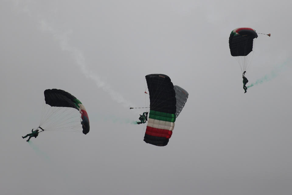 VARIOUS CITIES, MEXICO - SEPTEMBER 16: Parachuters of the Mexican army take part in the Independence Day military parade at Zocalo Square on September 16, 2020 in Various Cities, Mexico. This year El Zocalo remains closed for general public due to coronavirus restrictions. Every September 16 Mexico celebrates the beginning of the revolution uprising of 1810. (Photo by Hector Vivas/Getty Images)