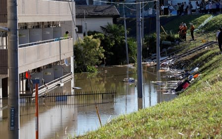 A view of an apartment building with a flooded first floor, at a flooded residential area due to Typhoon Hagibis, near the Tama River in Kawasaki