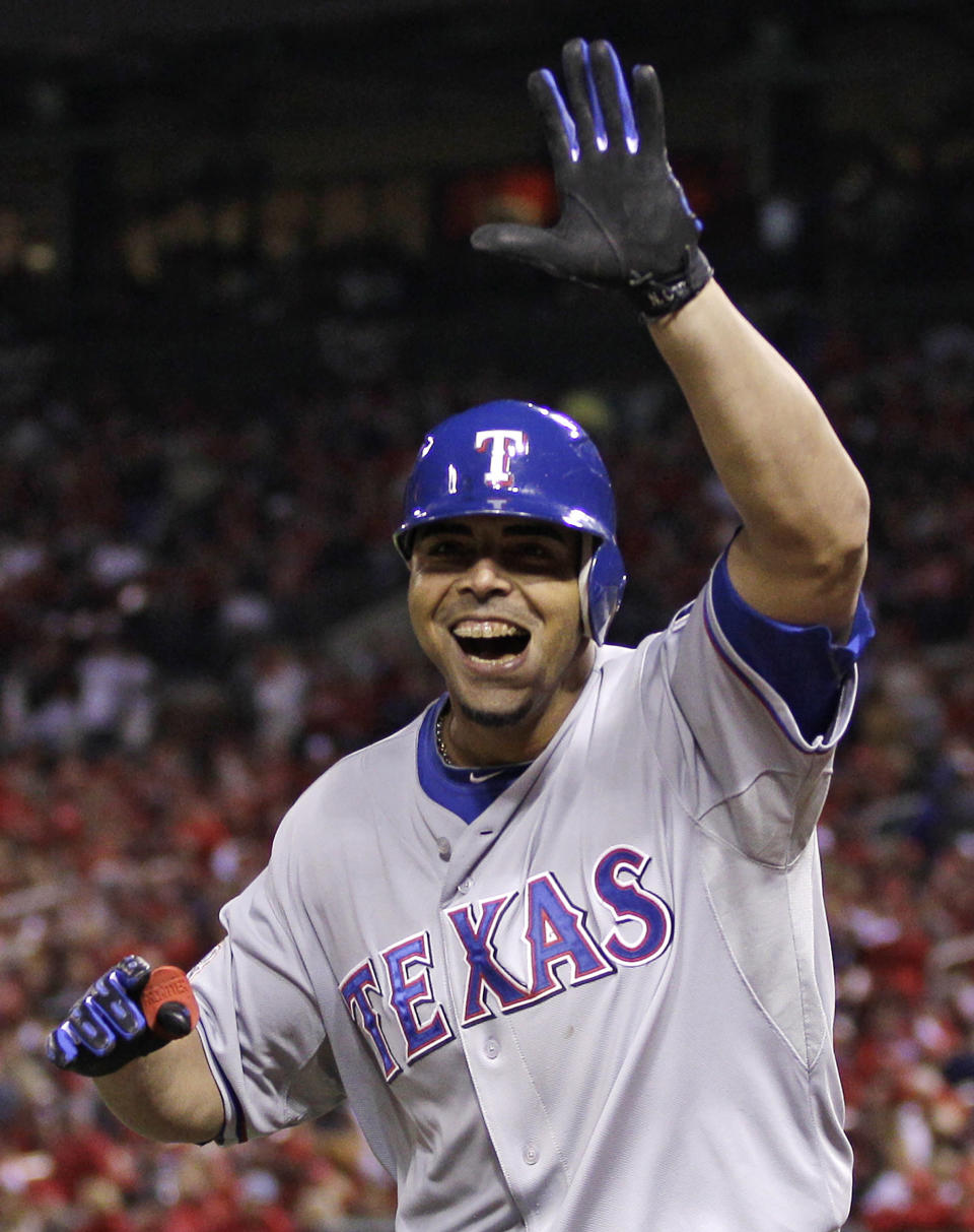 FILE - Texas Rangers' Nelson Cruz reacts after hitting a home run during the seventh inning of Game 6 of baseball's World Series against the St. Louis Cardinals, Oct. 27, 2011, in St. Louis. Cruz, a seven-time All-Star and 19-year Major League Baseball veteran, says he is retiring after 19 seasons. Cruz, who is 43, said on Adam Jones' podcast Friday, Nov. 2, 2023, that he plans to play this winter in the Dominican Professional Baseball League. (AP Photo/Matt Slocum, File)