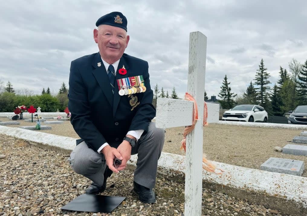 Brad Hrycyna, a retired major, is a volunteer researcher for the Last Post Fund's unmarked grave program. He's located 22 graves in a Swift Current, Sask., cemetery that were marked only with a white wooden cross. One of those crosses was replaced with a headstone last week. (Bonnie Allen/CBC - image credit)