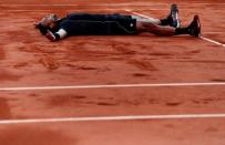 Tennis - French Open - Roland Garros, Paris, France - 2/6/15 Men's Singles - France's Jo Wilfried Tsonga celebrates winning his quarter final match Action Images via Reuters / Jason Cairnduff Livepic