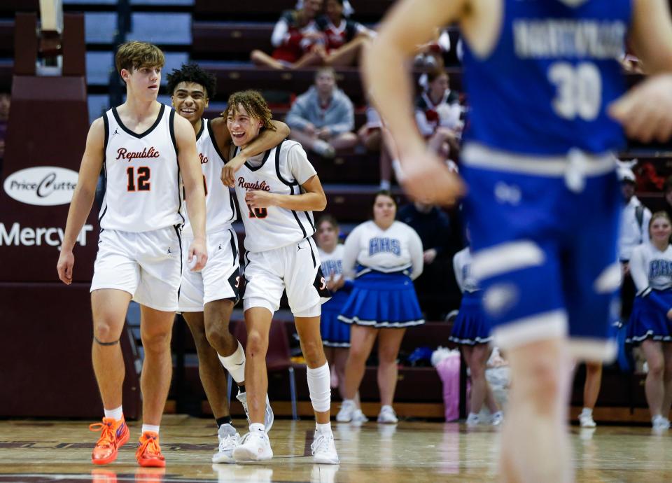 The Republic Tigers celebrate after beating the Hartville Eagles in overtime in a Blue Division semifinal game of the Blue & Gold Tournament at Great Southern Bank Arena on Wednesday, Dec. 28, 2022.