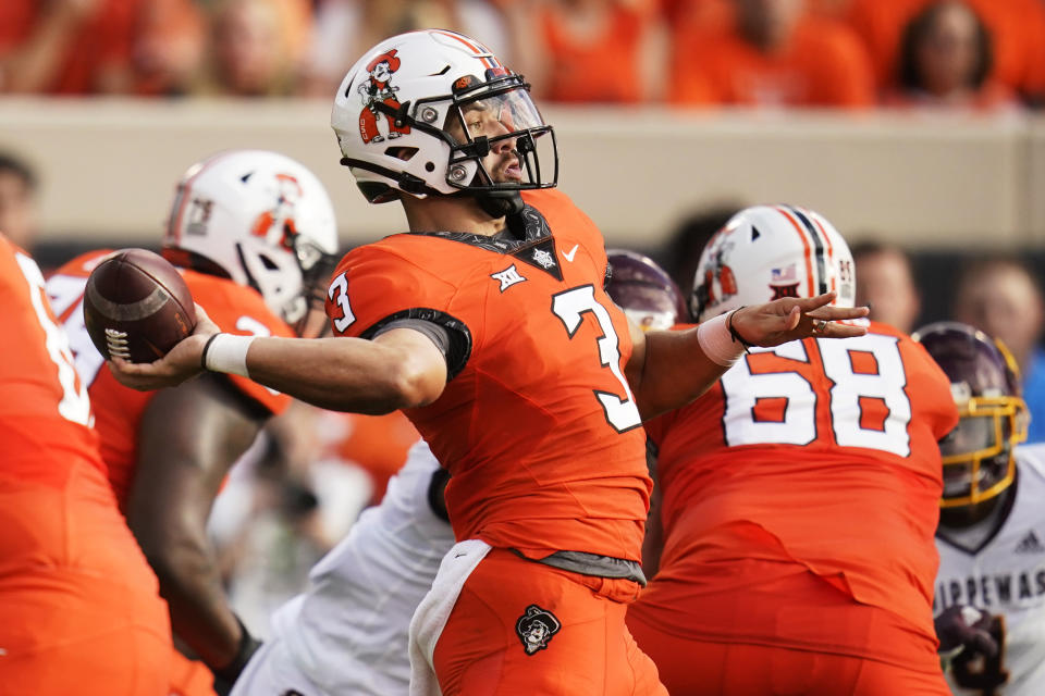 Oklahoma State quarterback Spencer Sanders (3) throws a pass during the first half of the team's NCAA college football game against Central Michigan, Thursday, Sept. 1, 2022, in Stillwater, Okla. (AP Photo/Sue Ogrocki)