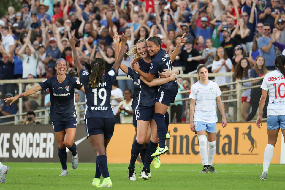 CARY, NC - OCTOBER 27: Samantha Mewis #5 of the North Carolina Courage celebrates scoring with teammates during a game between Chicago Red Stars and North Carolina Courage at Sahlen's Stadium at WakeMed Soccer Park on October 27, 2019 in Cary, North Carolina. The North Carolina Courage defeated the Chicago Red Stars 4-0 to win the 2019 NWSL Championship. (Photo by Andy Mead/ISI Photos/Getty Images).