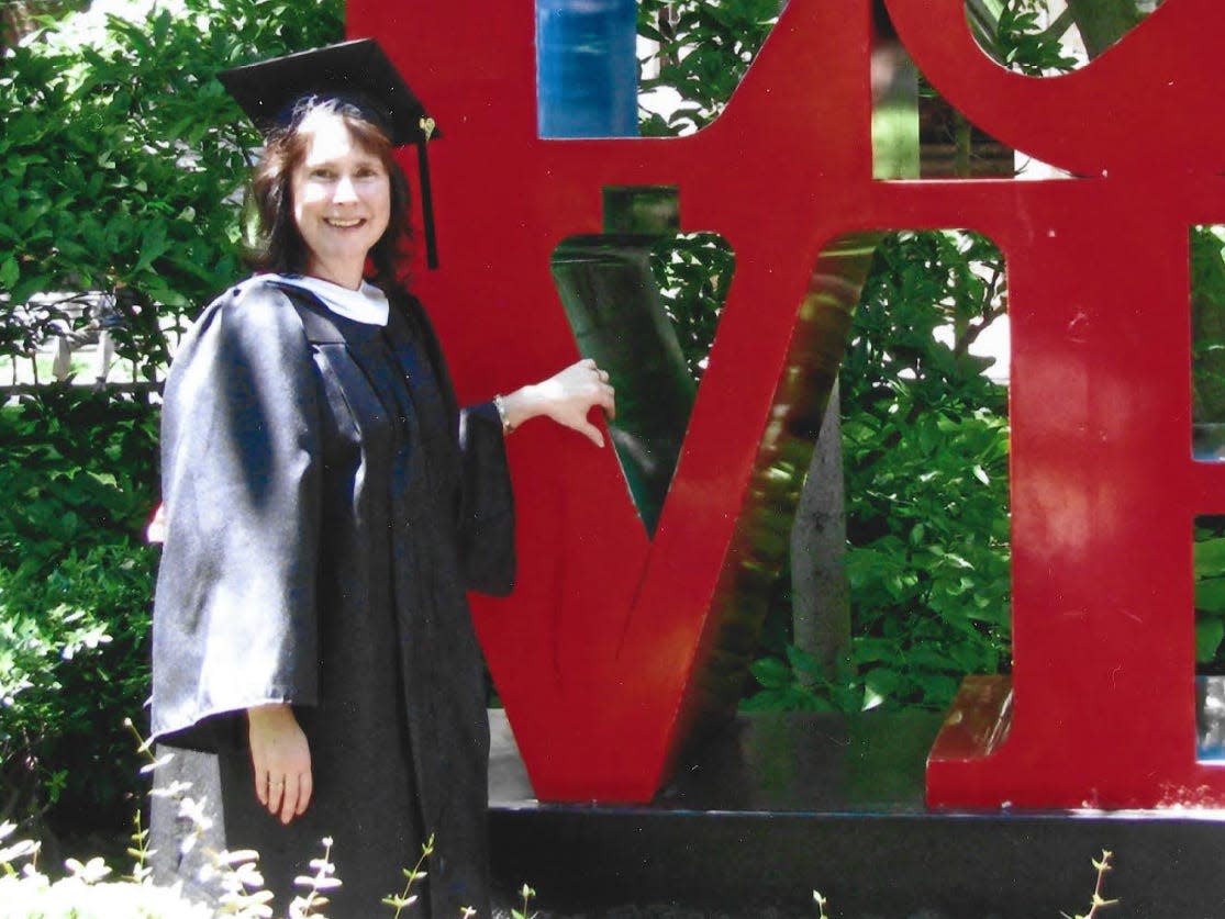 Victoria marie lees in her cap and gown