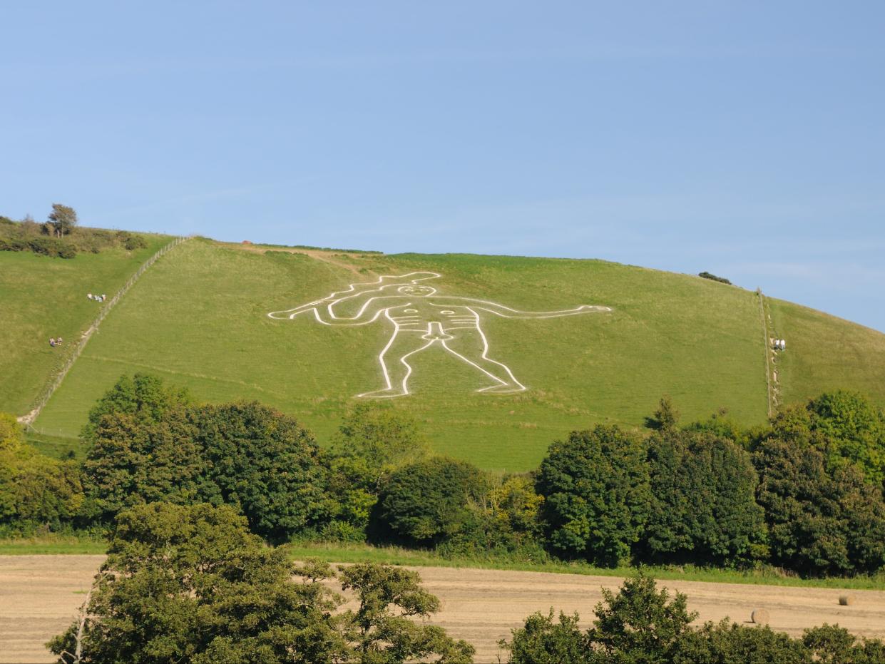 <p>The giant, carved in solid lines from the chalk bedrock, measures in at 55 metres high, and carries a huge knobbled club, which measures 37 metres in length</p> (Getty/iStock)