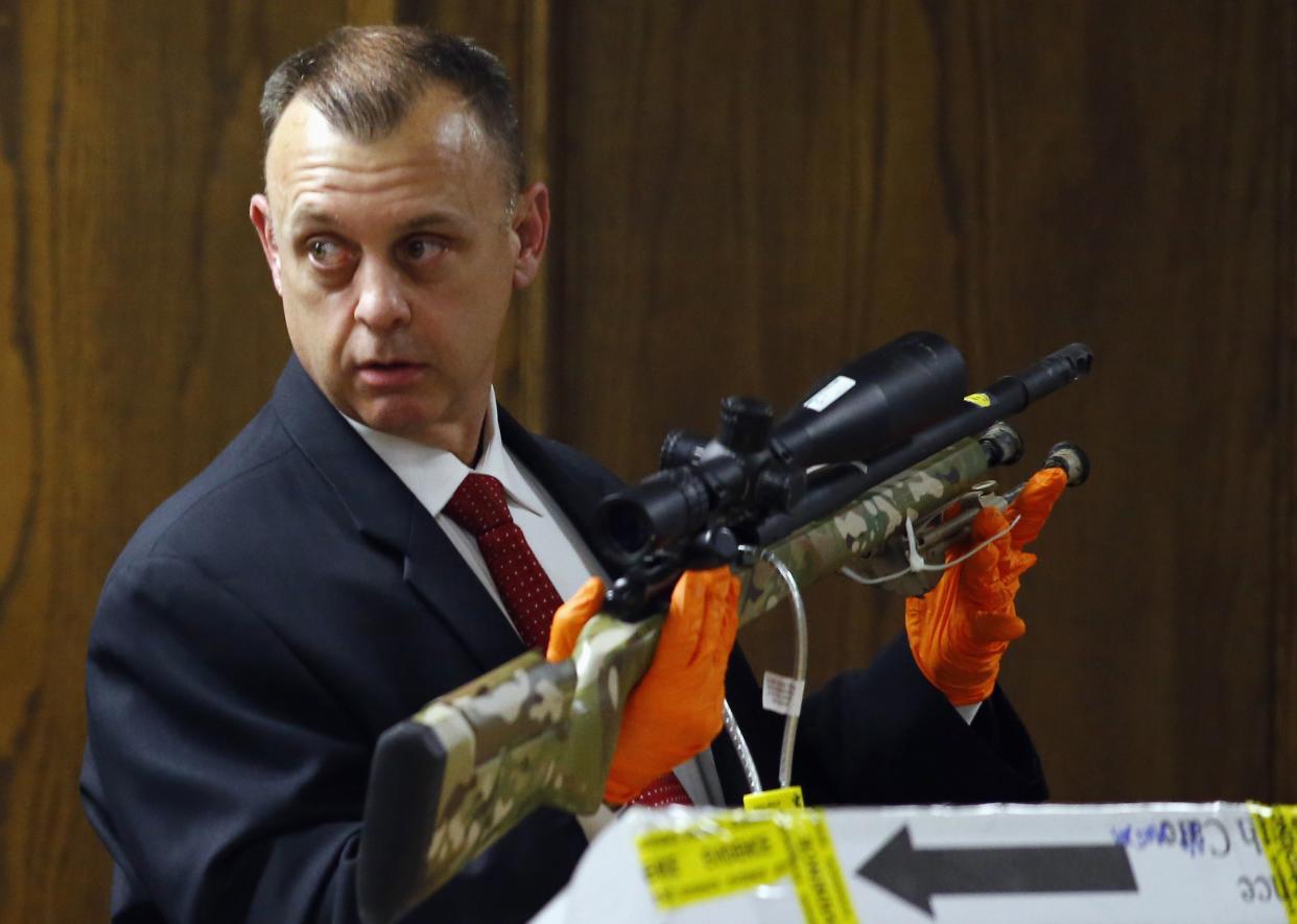 Investigator Michael Adcock testifies at trial about one of the rifles recovered from the crime scene where “American Sniper” Chris Kyle was killed. (REUTERS/Mike Stone)