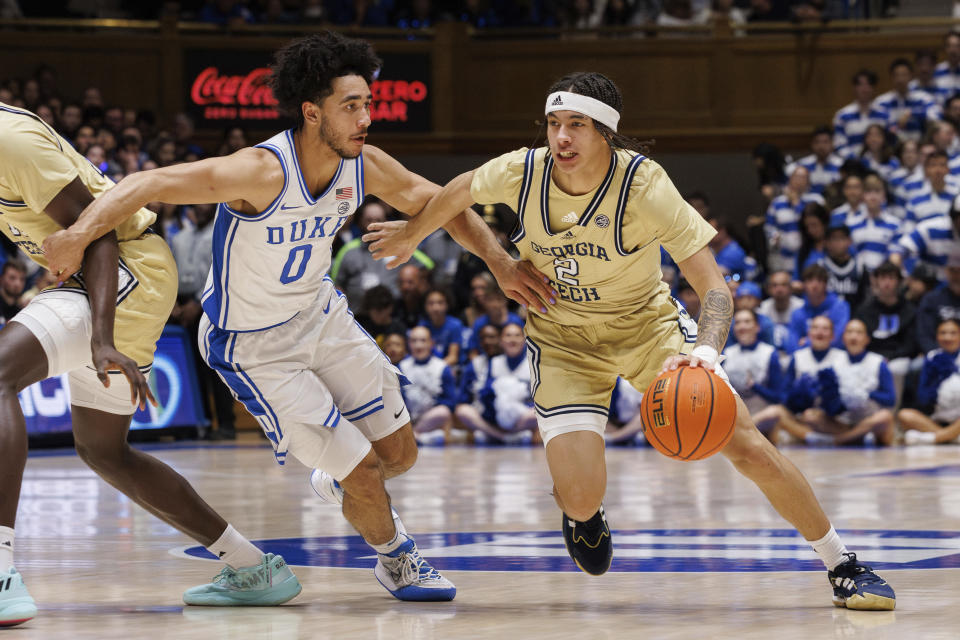 Georgia Tech's Naithan George (2) handles the ball as Duke's Jared McCain (0) defends during the first half of an NCAA college basketball game in Durham, N.C., Saturday, Jan. 13, 2024. (AP Photo/Ben McKeown)