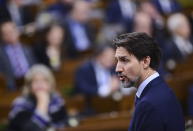 Canada Prime Minister Justin Trudeau delivers a statement in the House of Commons on Parliament Hill in Ottawa, Tuesday, Feb. 18, 2020,, regarding infrastructure disruptions caused by blockades across the country. (Sean Kilpatrick/The Canadian Press via AP)