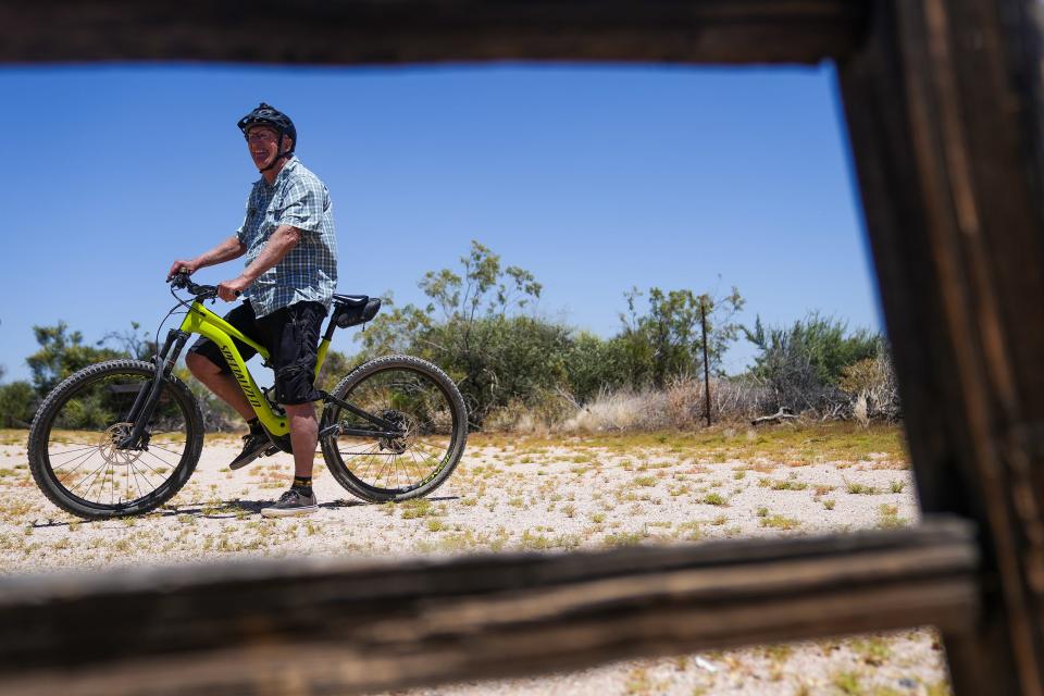 Rand Hubbell, former Park Supervisor for the McDowell Mountain Regional Park, poses for a portrait after riding the Pemberton Trail Loop on his e-bike on May 9, 2022, in Rio Verde.